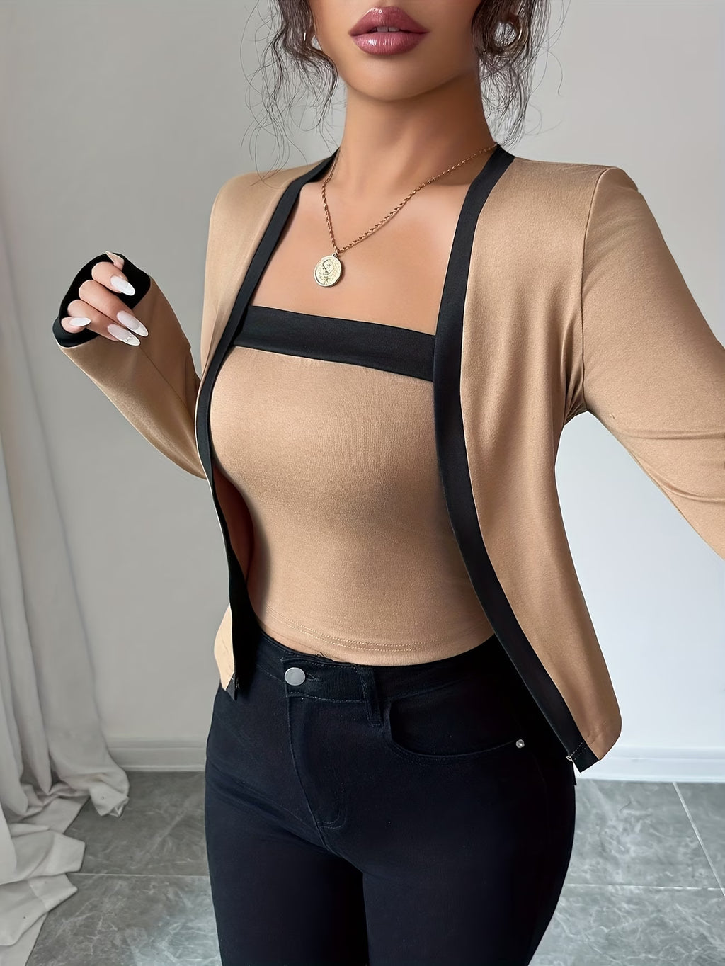 Elegant long-sleeve women’s top with color-block waist design