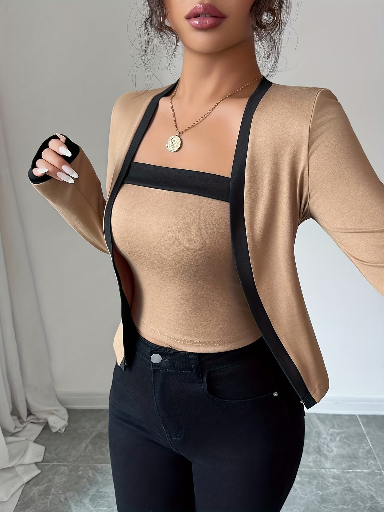 Elegant long-sleeve women’s top with color-block waist design