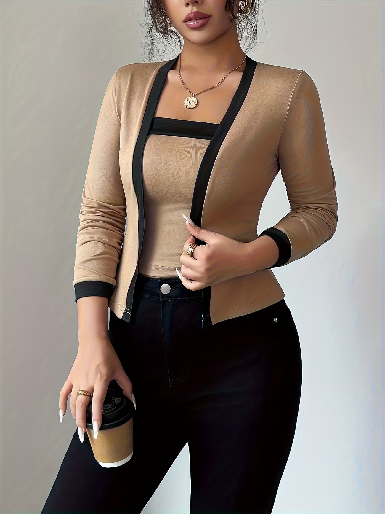 Elegant long-sleeve women’s top with color-block waist design