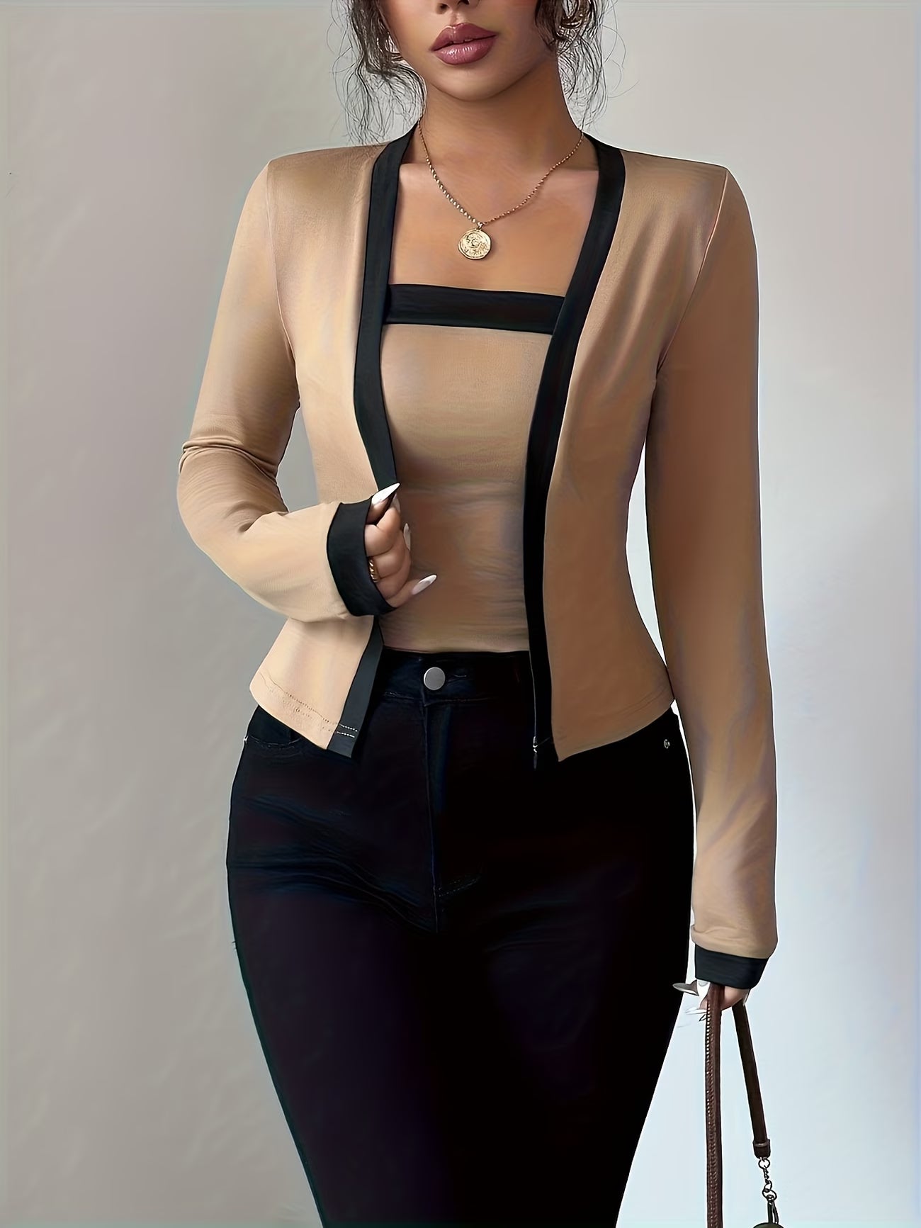 Elegant long-sleeve women’s top with color-block waist design