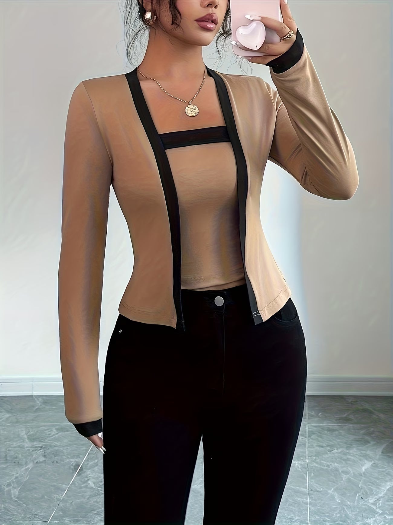 Elegant long-sleeve women’s top with color-block waist design